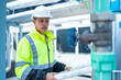 © Washburn - Engineer reads asbuil drawings to inspect chiller water pipes