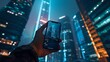 © goami - closeup shot of person holding mobile phone in hand and taking photo of night downtown of big city with skyscrapers, urban photography with smartphone camera