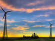 wind power generator silhouettes on yellow sunset background