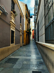 Sticker - Empty, narrow street in the center of the old town. Facade of historic old buildings.