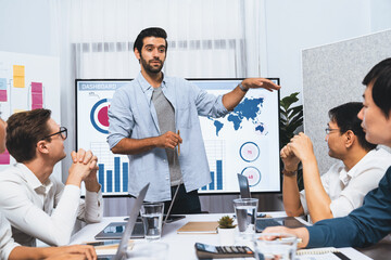 Wall Mural - Analyst team utilizing BI Fintech to analyze financial data at table in meeting room. Businesspeople analyzing BI dashboard power for business insight and strategic marketing planning. Prudent