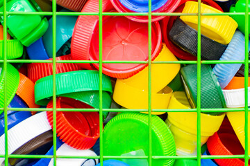 Wall Mural - Collected colorful plastic caps for recycling. concept of conservation and protection of the natural environment. Close-up