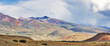panorama with red and green low mountains