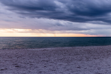 naples beach sunset with a storm coming