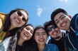 © yj - A group of friends smiling and posing for the camera, capturing their joyful expressions. The background is clear with a blue sky. an atmosphere of happiness among young people. generative AI