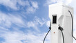 Close-up of electric charging station on a background of blue sky