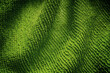 A green microfiber cleaning towel texture background. Close up.