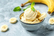 Healthy vegan banana ice cream in little bowl on table
