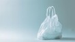 Empty white plastic bag isolated on light blue background. Minimalistic and clean design concept