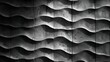 Black and white wavy tiles with rough texture forming an interesting background pattern