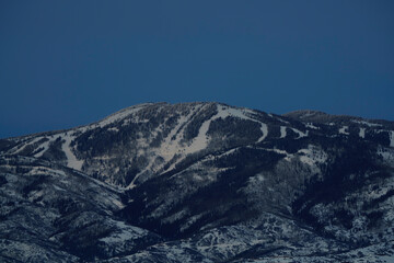 ski mountain at blue hour in steamboat colorado with copy space