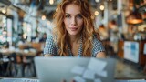 An office worker analyses statistics on a laptop