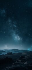a night sky with stars and a mountain range in the foreground and a distant star filled sky in the background..