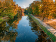 Multicolored forest by river at autumn, Bydgoszcz.