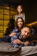 © fotohelen - A happy family poses in pajamas in New Year's locations.