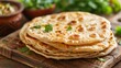 © we3_food - Chapati, traditional tortillas with fresh parsley . Generative Ai