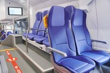 Fototapeta Niebo - Modern high speed train interior with empty blue seats. High quality photo