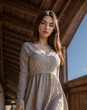 © Dreams Studio™ - Sensual portrait of cute Asian girl in a dress walking on the porch of a house. Low angle portrait, people and lifestyle concept