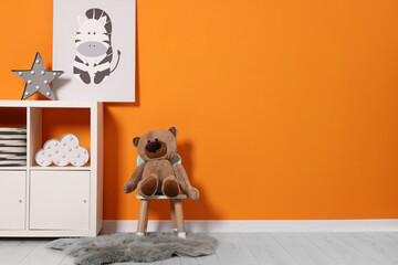 Sticker - Beautiful children's room with bright orange wall and furniture, space for text. Interior design