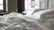A panoramic view of the entire bed from the perfectly smooth fitted sheet to the delicately folded coverlet p at the foot of the bed.