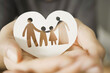 hands holding paper family cutout, foster care, homeless support, world mental health day, Autism support,homeschooling concept
