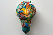 A light bulb is covered in trash and is lit up. The bulb is a symbol of the importance of recycling and reducing waste