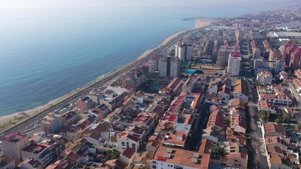 Wall Mural - Picturesque drone view of modern Vilassar de Mar cityscape on Mediterranean coast on sunny winter day, Spain