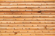 Stack of untreated wooden planks timber boards as construction material