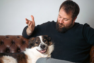 Sticker - Man sitting on the sofa with his dog.