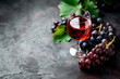 © Vasyl Onyskiv - Wine bottle, glass and grapes isolated on a granite background. Rose wine splashing in glassware