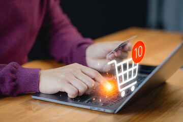 Poster - Customer uses a laptop computer to register through a credit card to make online purchases. Business concept of credit card shopping online, paying bills online, and various payments.