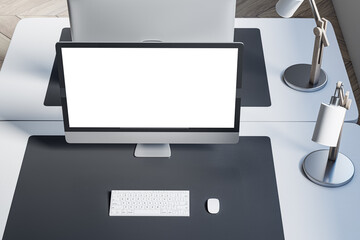 Poster - Close up and above view of designer office desktop with mock up computer monitor on white desk, rug, lamp and other items. Mock up, 3D Rendering.