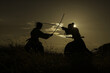 Intense Samurai Duel Silhouetted Against Twilight Sky
