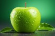 A single, crisp, Granny Smith apple sits on a glass table. The apple is wet from a recent washing. The apple is in focus, with a blurred green background.