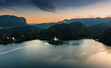 Fototapeta Big Ben - Bled, Slovenia - Aerial view of Pilgrimage Church of the Assumption of Maria at Lake Bled (Blejsko Jezero) with Julian Alps at backgroud on a summer afternoon at sunset
