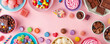 Pink Background Covered with a Colorful Assortment of Candies