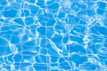 Sticker - Blue swimming pool water surface and ripple wave background. Summer abstract reflection caustics in swimming pool.