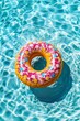 Colorful donut-shaped pool float in sparkling blue water