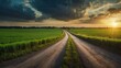 © sitifatimah - Serene sunrise over lush rural landscape with winding road