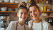 Two young girls smiling in a kitchen