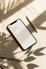 Poster - Modern smartphone with white blank screen on a textured surface highlighted by natural light