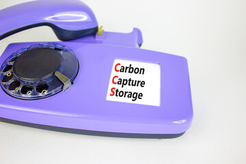 Wall Mural - CCS Carbon capture storage symbol. Concept words CCS Carbon capture storage on beautiful old disk phone. Beautiful white background. Business ecological Carbon capture storage concept. Copy space.