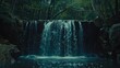   A waterfall, situated in a forest, pours copiously from its upper reaches