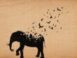 Elephant silhouette. Endangered animal. Death, afterlife. Flying bird.