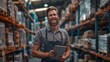 © Alena - A Smiling Warehouse Worker with Tablet