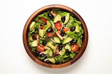 Wall Mural - Set against a pristine white studio background, a wooden bowl showcases a colorful vegetable salad composed of tomatoes, cucumbers, lettuce, onions, olives, and bell peppers.