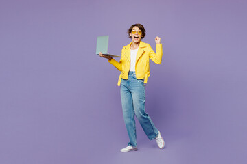 full body young smiling it woman wears yellow shirt white t-shirt casual clothes glasses hold use wo