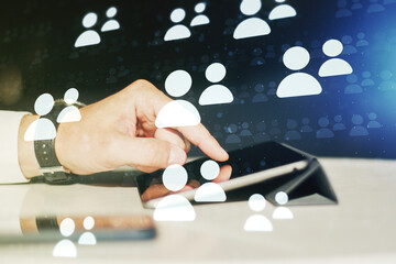 Poster - Double exposure of social network icons concept and hand working with a digital tablet on background. Networking concept