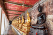 Awesome row of Buddha statues in Wat Suthat Thepwararam, Bangkok