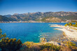 Picturesque view of the blue sea and rocky coast in the Budva Riviera. Montenegro, Balkans, Europe.